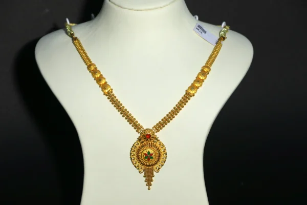 Woman wearing a Gold Chakra Pendant Necklace